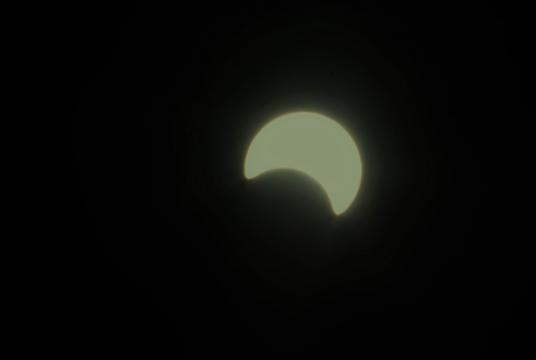 A partial solar eclipse is seen at Yangon (Photo-Nay Won Htet)
