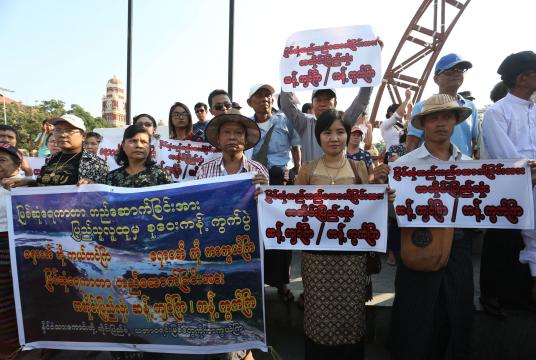 Protestors holding the banners to protest against Myitsone dam project in front of Maha Bandoola Park on January 27 (Photo-Kyi Naing)