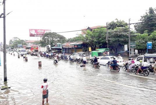Water covered Yangon-Bago Road on September 13