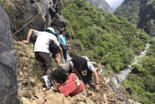 File picture of rescue workers trying to free a trapped tourist at the Taroko National Park following the April 18 earthquake. 