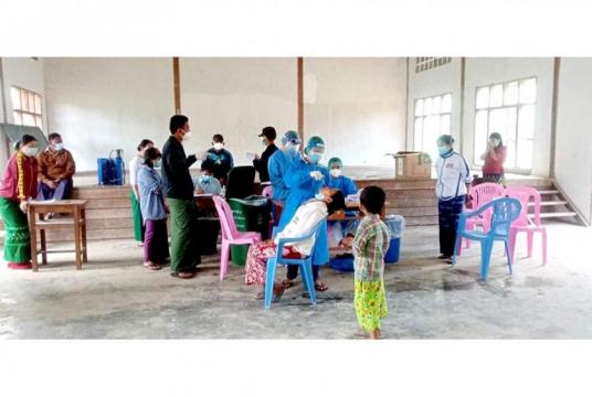 Caption: Students, teachers and parents are being tested for COVID-19 in Shinbyawyan high school in Tanine Township (Photo-Jawjet)
