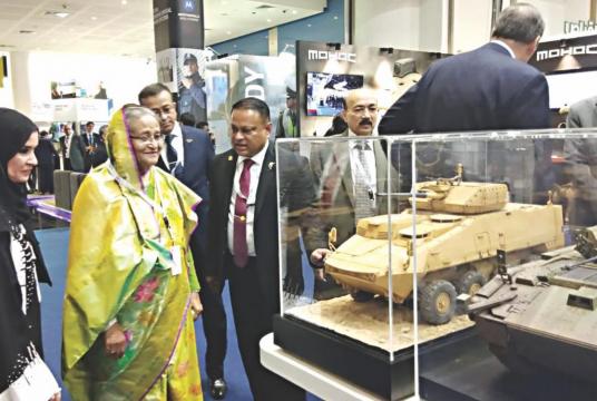 Prime Minister Sheikh Hasina looks at scale model tanks during the inauguration of International Defence Exhibition at Abu Dhabi National Exhibition Centre yesterday morning. Photo: PID