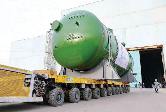 A trailer carries a reactor pressure vessel, to be installed at Rooppur Nuclear Power Plant, out of a factory in Russia in August. The equipment reached Mongla Sea Port in Khulna yesterday. The government is implementing the power plant project in Pabna to reduce its dependence on fossil fuels. Photo: Collected