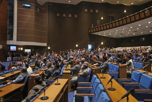 Lawmakers raise their hands in support of the government’s policies and programmes that were endorsed through majority during a meeting of House of Representatives in the Capital on Tuesday. Post Photo: Elite Joshi