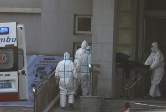 Medical staff transfer a patient from an ambulance at the Jinyintan hospital, where the patients with pneumonia caused by the new strain of coronavirus are being treated, in Wuhan, Hubei province, on Jan 20, 2020.PHOTO: REUTERS