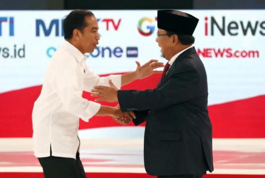 Presidential candidates Joko Widodo (left) and Prabowo Subianto shake hands during a debate among candidates in Jakarta, Indonesia, on Feb 17, 2019.PHOTO: EPA-EFE