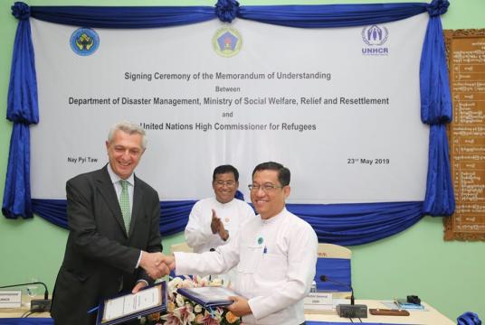 Filippo Grandi, UN High Commissioner for Refugees (left), exchanges the MoU with Dr.Ko Ko Naing, a director general at the Ministry of Social Welfare, Relief and Resettlement, in Nay Pyi Taw (Photo courtesy of Ministry of Social Welfare, Relief and Resettlement)