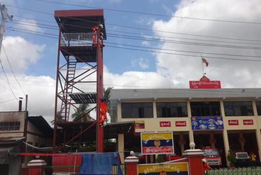 An old photo shows firefighters exercising drills at Shwebo District Fire Station. 