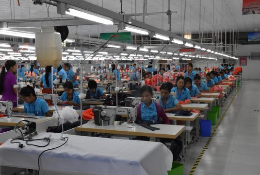 The photo shows a garment factory in an industrial zone in Yangon.
