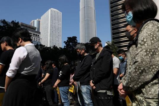 In a photo taken on Dec 2, 2019, anti-government demonstrators observe a moment of silence as people gather for a lunchtime protest at Chater Garden in Hong Kong.PHOTO: REUTERS