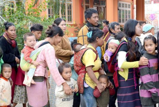 Photo shows children among war refugees fleeing to Lashio. 