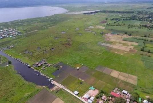 The photo shows an aerial view of 90 acres of natural floating island in Mongthauk, Nyaungshwe Township, Shan State.