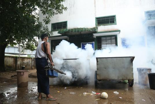 A man fumigates a building in Tamwe Township in Yangon. (Photo-Kyi Naing)