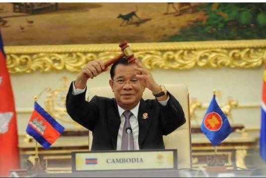 Prime Minister Hun Sen holds the ceremonial gavel as the Kingdom takes over the ASEAN chairmanship for a third time, on Thursday. SPM