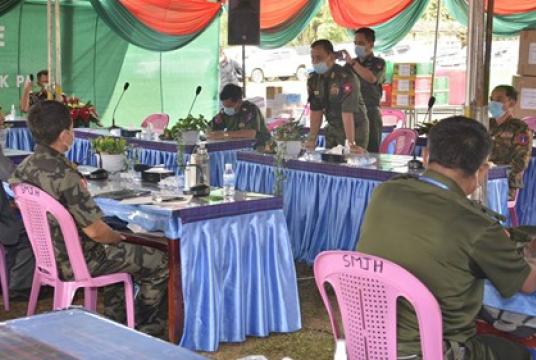 Military and KIA officials seen at a ceremony to donate medical supplies for Covid-19 in Maisapar near Laiza on May 20 