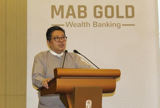 Photo- Kyaw Ni Khin, chief business office at Myanmar Apex Bank, delivers a speech at the launch of MAB Gold wealth banking in Yangon (Photo- KhineKyaw, Myanmar Eleven)