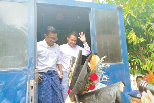 Kyaw Zaw Lin, Chief Editor, Na Yi Min, Edtors-In-Charge and Chief Reporter Phyo Wai are brought to the trial. (Kyi Naing)