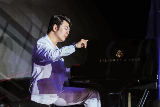 Lang Lang plays pieces from his upcoming album, Piano Book, scheduled to be released on March 29, at an event in Beijing. (PHOTO / CHINA DAILY)