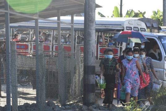 Workers arriving at their worksite of an industrial zone in Yangon 
