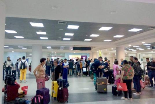 Tourists are seen at Mandalay Airport.