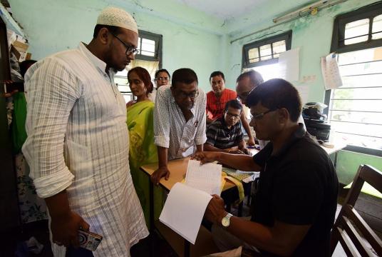 People get their names checked on the draft list at a National Register of Citizens (NRC) Centre in Nagaon. (File Photo: IANS) 