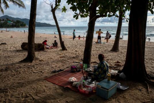People at a beach in Phuket, on Sept 19, 2021. The island successfully reopened to vaccinated visitors in a pilot scheme.PHOTO: REUTERS
