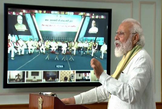 Prime Minister Narendra Modi dedicates to the nation a 750-megawatt ultra mega solar power plant set up at Rewa in Madhya Pradesh through video conference from Delhi. (Photo: Twitter | @BJP4India)