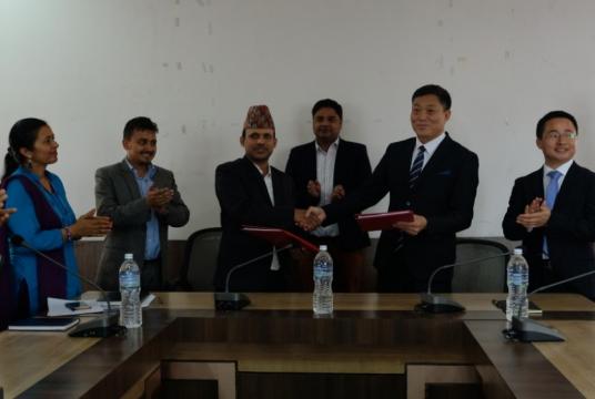 A handout photo shows officials from Nepal Intermodal Transport Development Board (NITDB) and Tibet Fuli Construction Group Company Limited during the signing ceremony. Photo Courtesy: NITBD