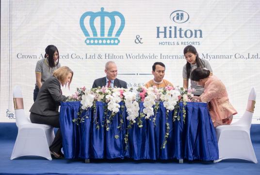 A MoU signing ceremony of Hilton Times City Yangon is in progress.  