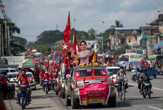 Supporters of the NLD party take part in an election campaign rally with a cut-out portrait of State Counsellor Aung San Suu Kyi on the outskirts of Yangon on Oct 25, 2020.PHOTO: AFP