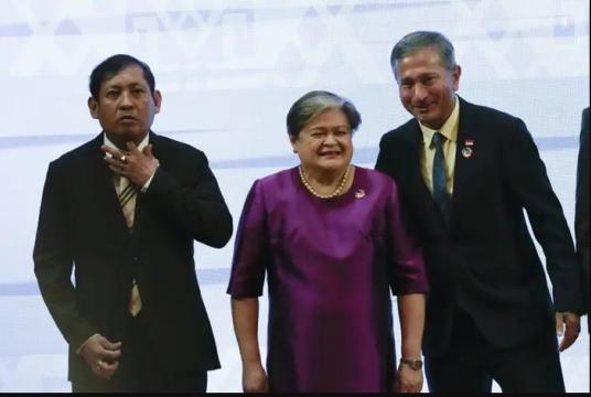 Myanmar's Foreign Secretary Aung Kyaw Moe, Philippine Foreign Undersecretary Theresa Lazaro and Singaporean Foreign Minister Vivian Balakrishnan posing for a group photo at the Asean Foreign Ministers' Meeting in Vientiane on Oct 8, 2024. - AP