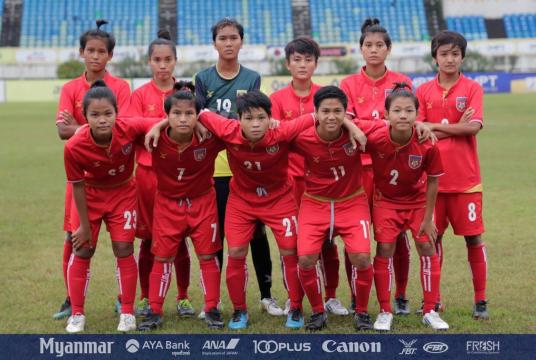 Myanmar U-19 women's football squad on the pitch.