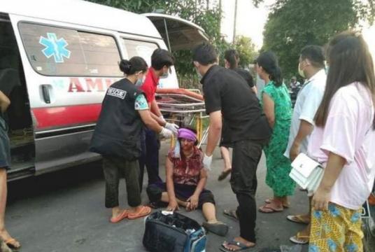 A woman receiving medical treatment after being mugged in Myitkyina.  