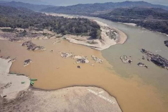 Photo shows the extremely muddy water of the Ayeyawady confluence caused by resource extraction. 