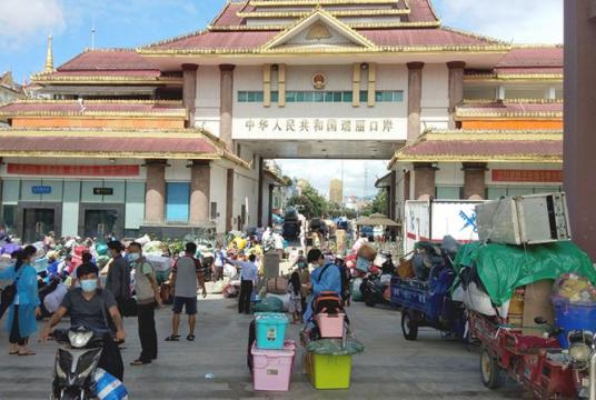 Myanmar migrant workers seen at Nandaw border checkpoint after returning from China