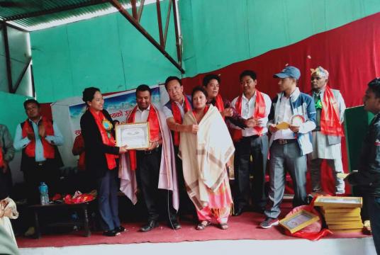 An elected representative honours 12 inter-caste couples at the Bahrabise Municipality office
