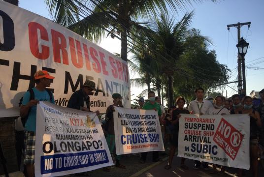 Around 200 people gathered Tuesday at the Volunteers’ Park outside the Subic Bay Freeport to call on authorities to stop a cruise ship with Chinese tourists from coming to Subic Bay. (Photo by Joanna Rose Aglibot)
