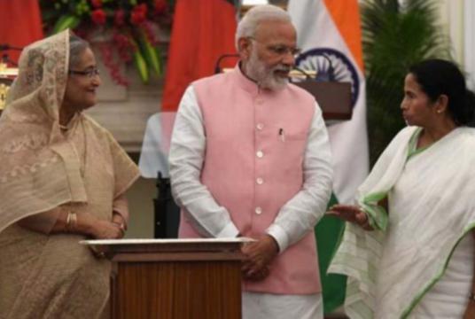 Bangladesh Prime Minister Sheikh Hasina (L) and Indian Prime Minister Narendra Modi (C) listen to West Bengal Chief Minister Mamata Banerjee during an agreement signing ceremony after a meeting in New Delhi, on April 8, 2017. PHOTO: AFP