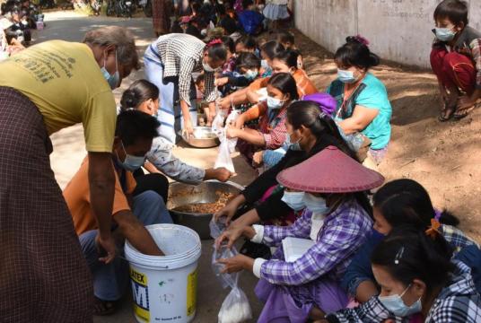 The grassroots are queuing up for the meals from the monastery (Photo-Min Thant)