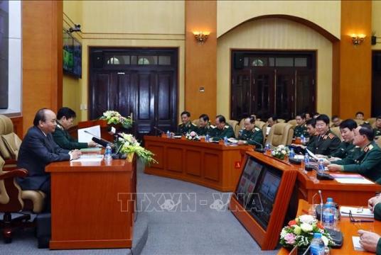 Prime Minister Nguyễn Xuân Phúc addressed an online meeting held at the headquarters of the Ministry of Defence in Hà Nội on Thursday. — VNA/VNS Photo Thống Nhất