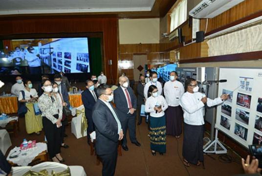 Caption: Spokesman of SAC shows and explains the photos related to PDF activities to diplomats at the press conference held on August 27.