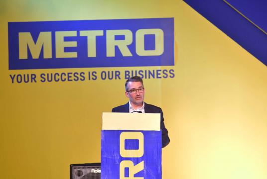 Philippe Palazzi, chief operating officer and member of the management board of Metro AG, delivers a speech at the grand launch ceremony of Metro Wholesale Myanmar Ltd in Yangon