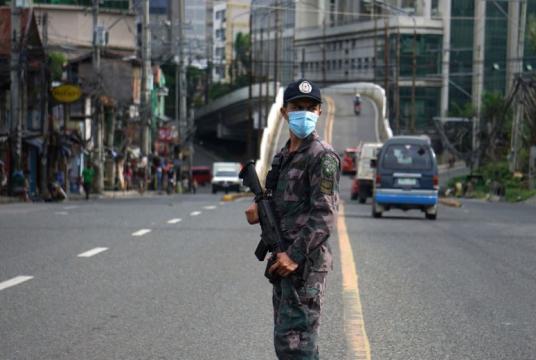A police officer mans a checkpoint along a road in Cebu City, central Philippines on June 24, 2020.PHOTO: AFP