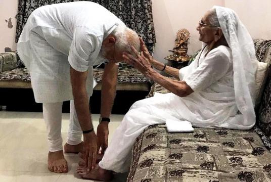 Narendra Modi seeks blessings of his mother Heeraben Modi at her residence in Gandhinagar on May 26, 2019. (Photo: IANS/BJP)
