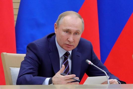 Russian President Vladimir Putin. (Photo by Mikhail KLIMENTYEV / SPUTNIK / AFP)