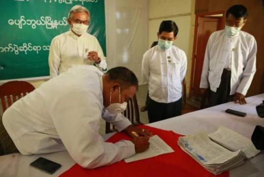 USDP officials seen signing a petition to be sent to UEC