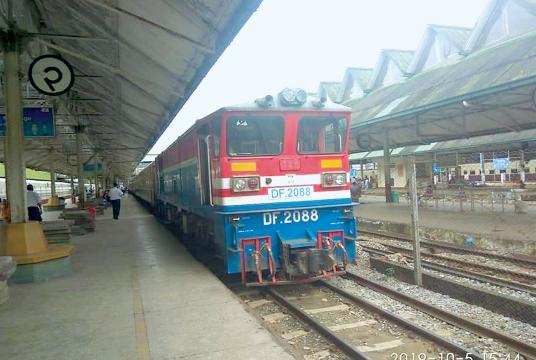 A train is entering Yangon Railway Station. 