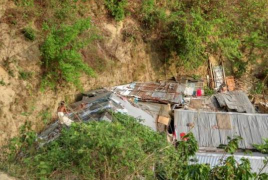 Despite the risk of landslide in rains and consequent casualties, some families keep living in these tin houses at the foot of Tankir hill of Chattogram. More than 5,000 people are dwelling in the hills of the port city under landslide threat, according to a survey of the district administration. Photo: Rajib Raihan