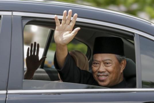 Malaysia's new Prime Minister Muhyiddin Yassin waves to the media after his inauguration ceremony, on March 1, 2020.PHOTO: EPA-EFE