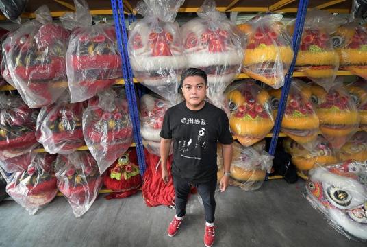 Briyani chef Ahmad Zahid Isnin's hobbies include death metal music and Chinese lion dance. Joining a troupe was one of his childhood dreams.ST PHOTO: ALPHONSUS CHERN